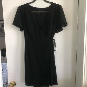 Black wrap dress with small polka dots details